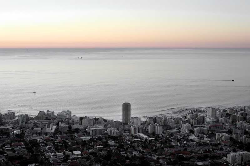Photo: View of Sea Point and Table Bay. The margins of Robben Island (where Nelson Mandela was imprisoned) are fainting on the right. Cape Town, April, 2011